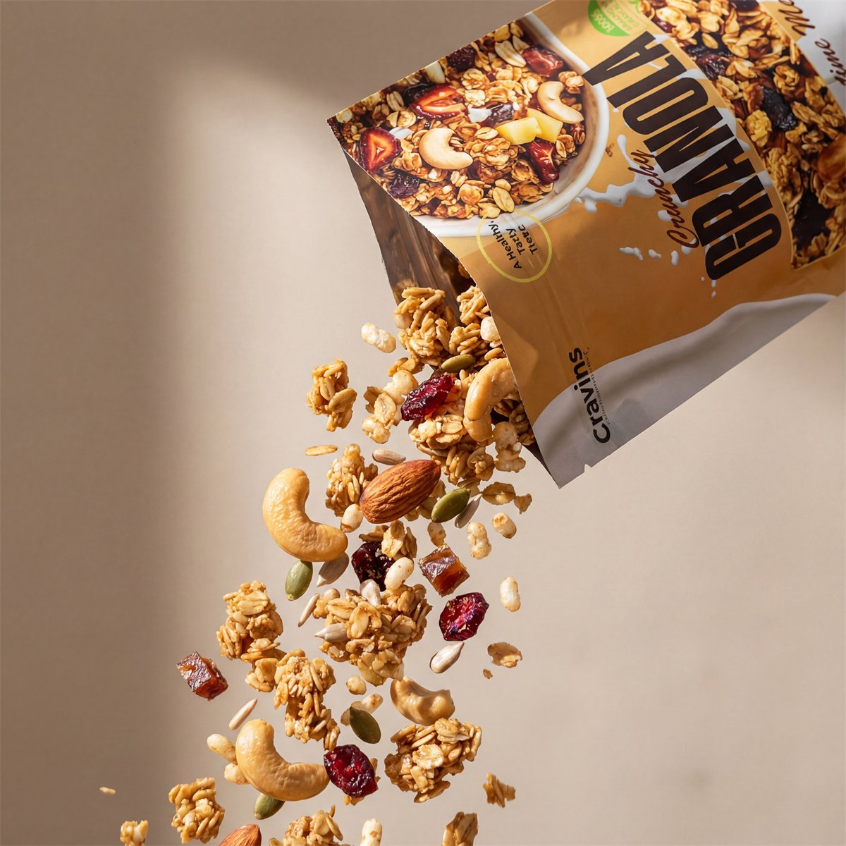 Cravins Crunchy Granola pouring from the pouch